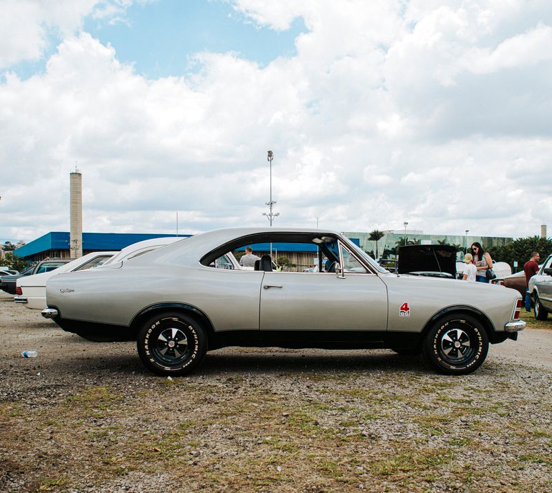 A polished classic car at an outdoor car show