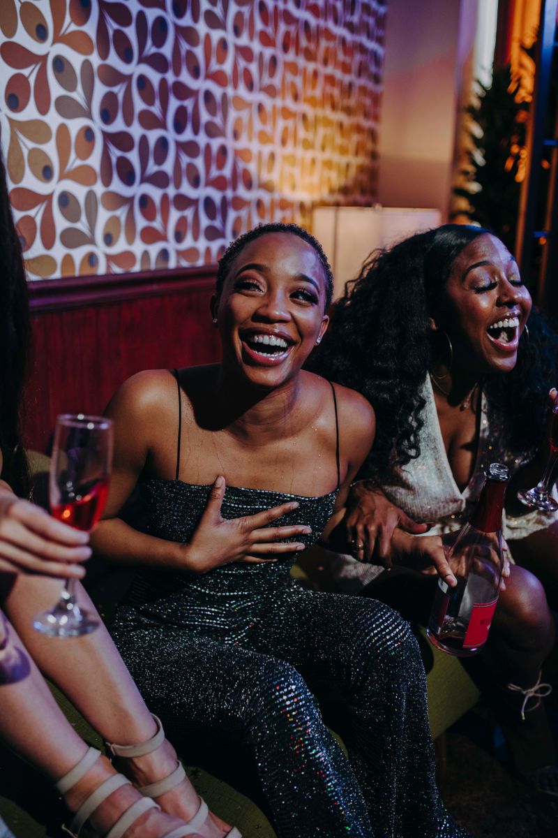 Friends laughing and celebrating together at an indoor party
