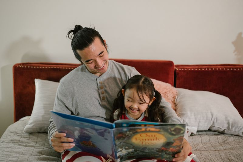 A parent reading a picture book with a young child