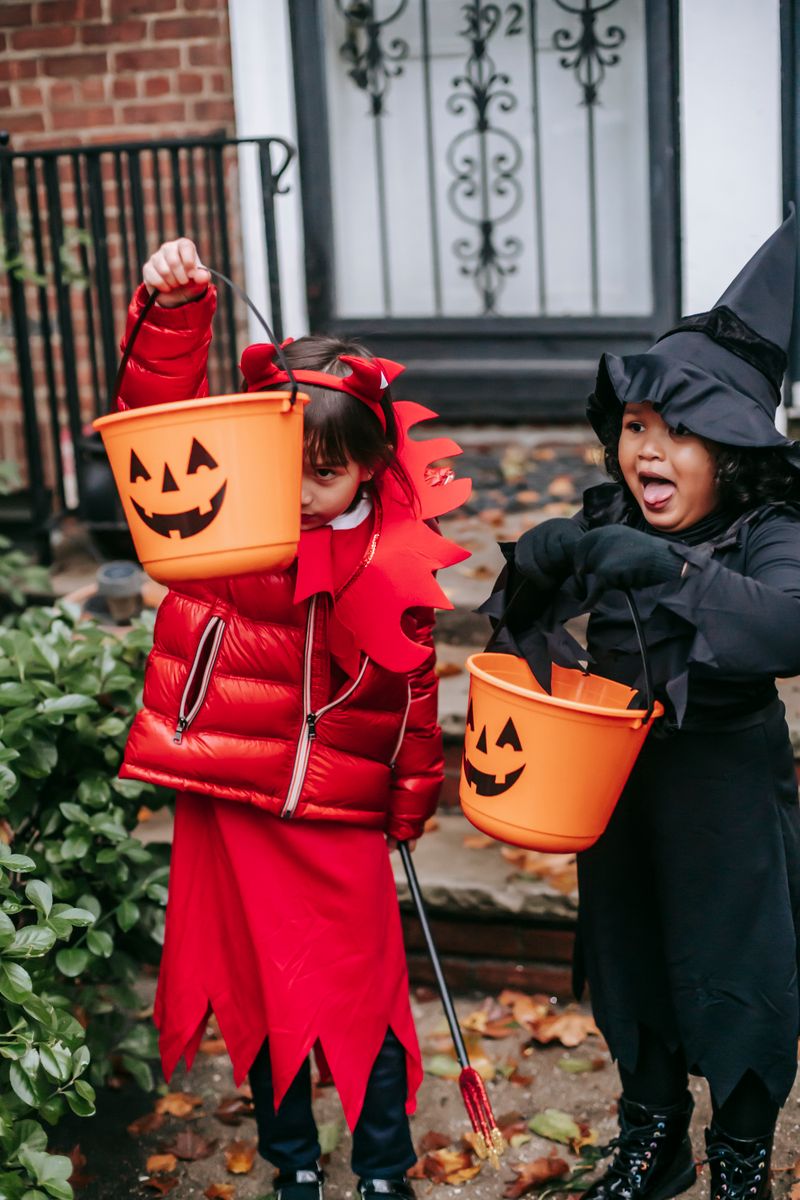 Kids in Halloween costumes trick-or-treating